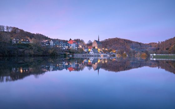 Panoramic image of Beyenburg lake with water reflection and autumnal colors, Wuppertal, Bergisches Land, Germany