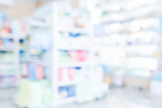 Pharmacy blurred abstract background qualified drug, medicinal product on shelf background. Blurry light tone wallpaper of drugstore's interior medications displayed on shelves for healthcare concept.