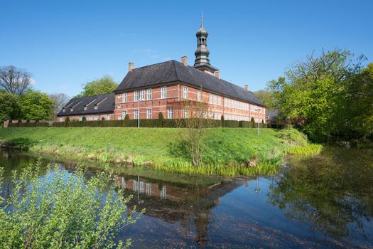 HUSUM, GERMANY - MAY 8, 2022: Husum Castle against blue sky, tourist attraction of Husum on May 8, 2022 in North Frisia, Germany