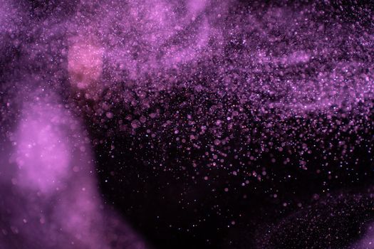Abstract real dust particles on black background. Glittering sparkling bokeh overlay design with copy space for text. High quality photo