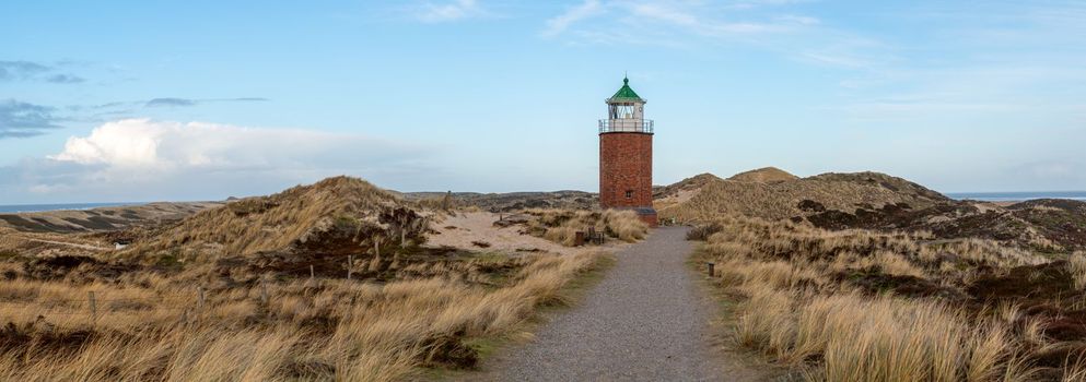 Panoramic image of Kampen lighthouse against blue sky, Sylt, North Frisia, Germany 