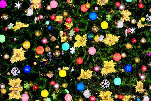 the annual Christian festival celebrating Christ's birth, held on December 25 in the Western Church.New Year's Christmas background with toys, garlands and Christmas tree branches.