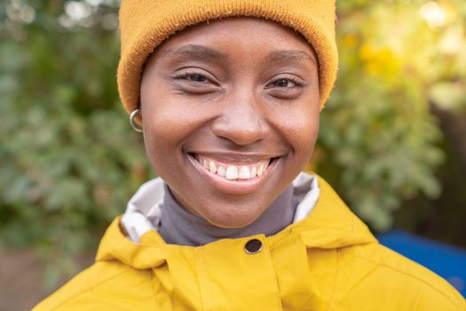 Portrait of african american woman smiling at nature - Pleased black girl in love with life. High quality photo