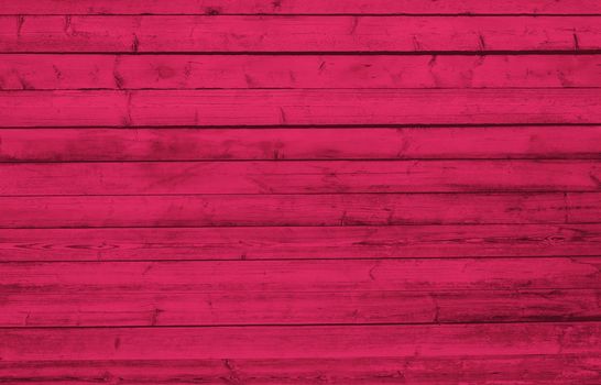 Texture of Viva Magenta wooden boards. Grunge texture old wood. Viva Magenta color wood texture background surface with old natural pattern. Wood texture background, wood planks. Color trendy 2023.