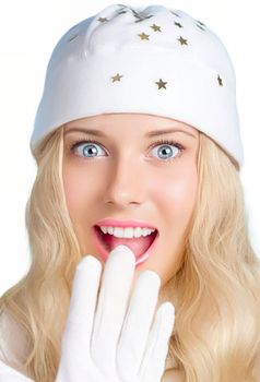 Happy holidays and a woman in white hat and white gloves on white background, model depicting a festivity, beauty, and fashion. Surprised blonde woman smiling and enjoying the Christmas, New Year, and winter vacations.