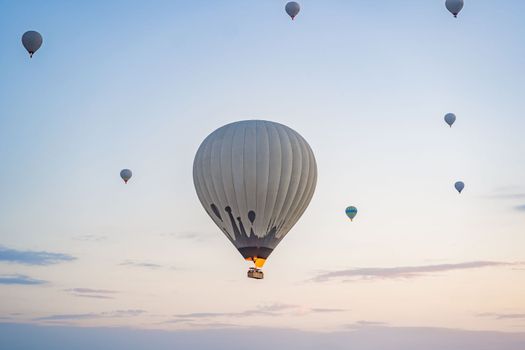 Colorful hot air balloon flying over Cappadocia, Turkey.