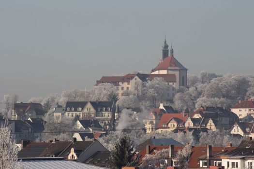 St. Lioba Chirch on Petersberg under snow in winter, part of city Fulda in Hesse Germany High quality photo