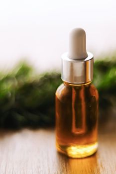 Organic oil serum bottle, beauty and skincare product.