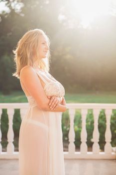 beautiful blonde in a nightgown came out on the porch at dawn.