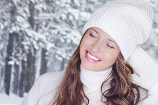 Winter holiday travel, lifestyle and fashion, beautiful happy woman and snowy forest, nature, ski resort and leisure activity outdoors Christmas, New Year and holidays portrait.