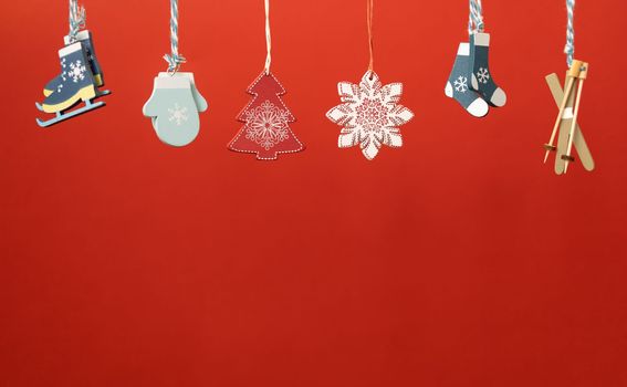 christmas decoration toys hanging over red background. High quality photo