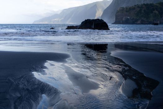 black sand beach of Madeira view on mountains. High quality photo