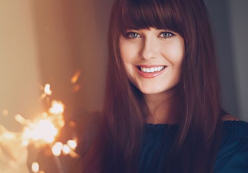 Holiday magic, Christmas and New Year celebration, happy woman with sparklers, portrait