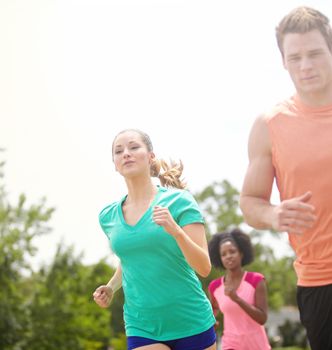 Challenging the women. a group of athletes running outdoors