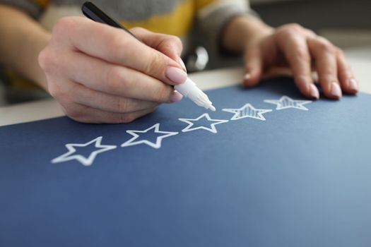 Businesswoman draws 5 out of 5 stars. Great or perfect review concept