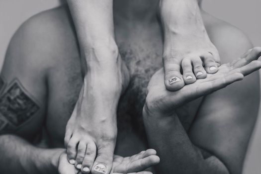 woman stands in the palms of her man.