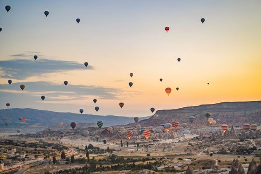 Colorful hot air balloon flying over Cappadocia, Turkey.