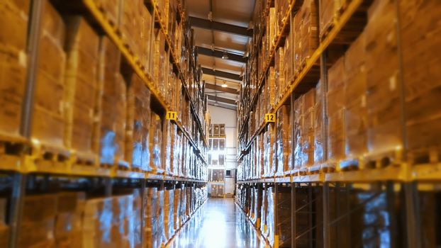 A large warehouse, with high racks, full of goods. storehouse in the enterprise, factory. High quality photo