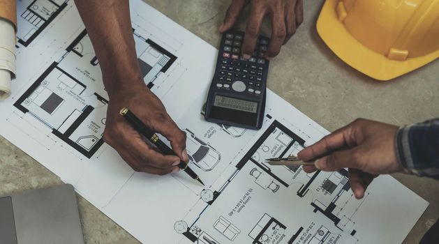 Engineer Teamwork Meeting, Drawing working on blueprint meeting for project working with partner on model building and engineering tools in working site, Construction and structure concept.