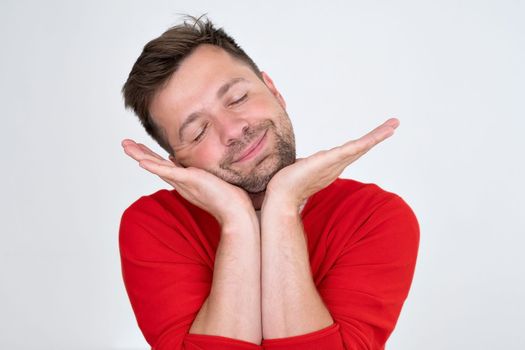 Confident young man looking away dreaming. Funny handsome guy hinking about the future. Closeup face of smiling casual man 