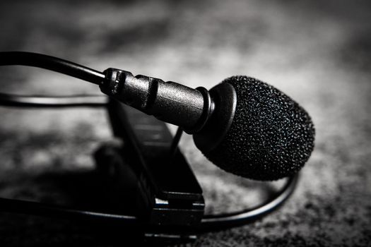 Close-up view of a lavalier microphone. Sound or voice equipment for recording.