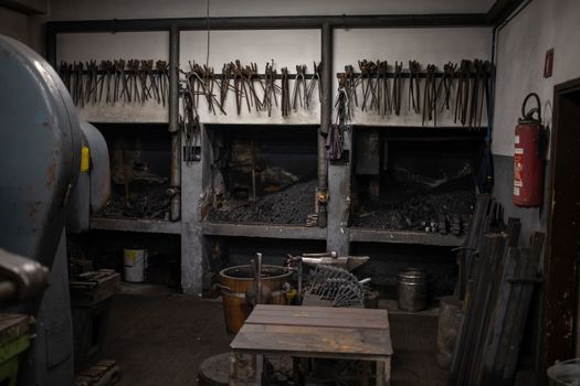 blacksmith tools and metal blanks in privet forge. High quality photo