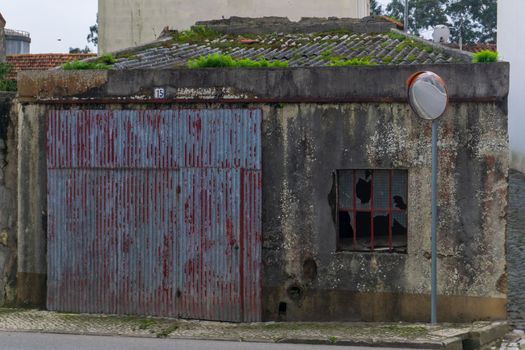 Antique picturesque abandoned garage in a Portuguese town