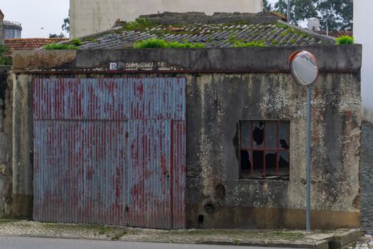 Antique picturesque abandoned garage in a Portuguese town