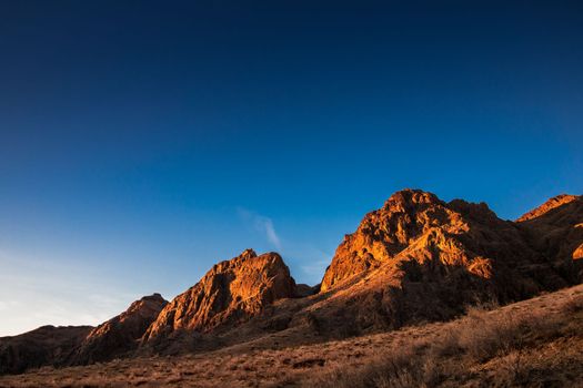 Sunrise rocky picturesque landscape near the Ili River in the Almaty region of Kazakhstan.