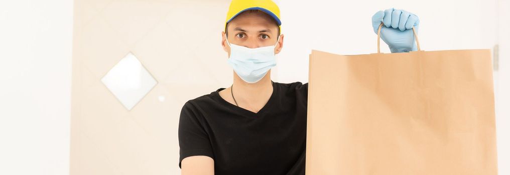 delivery man in protective gloves and a mask.