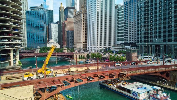 Image of Construction in Chicago on bridge over canals by skyscrapers