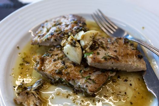 Grilled tuna steak in herb garlic and lemon marinade. High quality photo