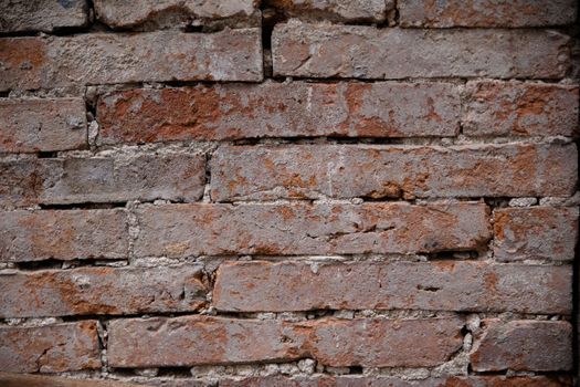Grunge Brickwall With Broken Stucco Texture. Old Brick Wall With Damaged Shabby Gloom Plaster Layer Background. Fade Distressed Stonewall Wallpaper. Chipped Rough Decay Worn Wreck Red Stonewall. High quality photo