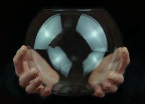 transparent glass ball in hands . High quality photo