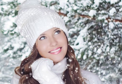 Winter holiday travel, lifestyle and fashion, beautiful happy woman and snowy forest, nature, ski resort and leisure activity outdoors Christmas, New Year and holidays portrait.