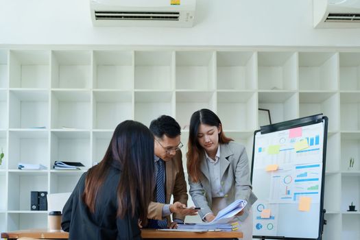 Asian entrepreneurs and business people meeting in a conference room in business planning, financial budget and investment risk assessment to analyze customer groups to increase company growth.