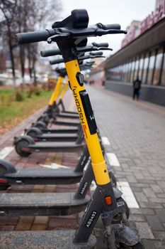 21.10.2022, Tomsk, Russia. Electric scooters for Public Use, Standing on a city street, Public mobile Transport. Electric scooters for rent, for rent An electric scooter is an economical vehicle 