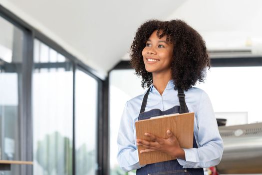 Successful Small Business Startup Small business owner SME Beauty Girl standing in front of a coffee shop with her arms crossed. Picture of an Asian female barista cafe owner...