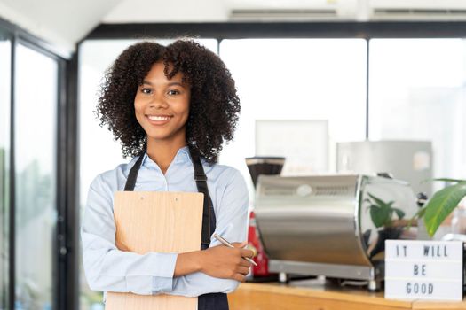 Successful Small Business Startup Small business owner SME Beauty Girl standing in front of a coffee shop with her arms crossed. Picture of an Asian female barista cafe owner...