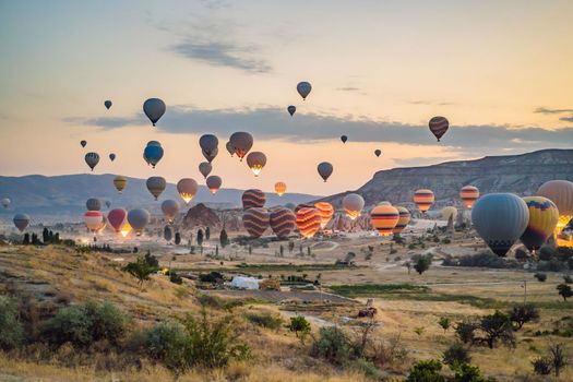 Colorful hot air balloon flying over Cappadocia, Turkey.