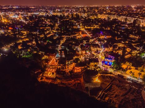 Night top aerial view of the old town Kaleici and old harbor in Antalya, Turkey. Turkey is a popular tourist destination.