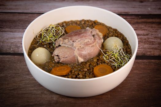Recipe for salted pork shank with lentils. High quality photo