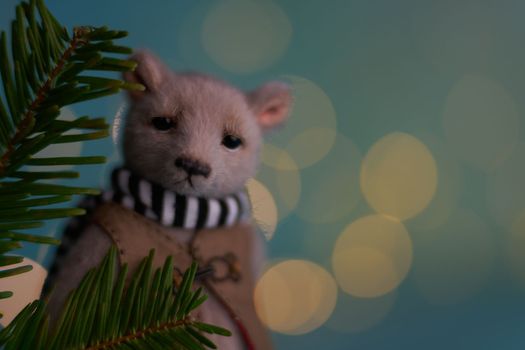 Cute teddy bear isolated on Christmas light background. Holiday glowing backdrop. Defocused Background With Blinking light. Blurred Bokeh. High quality photo