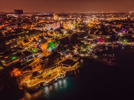 Night top aerial view of the old town Kaleici and old harbor in Antalya, Turkey. Turkey is a popular tourist destination.