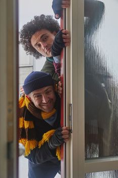 Skive, Denmark, December 2022: Delivery workers pretend to be robbers fooling around