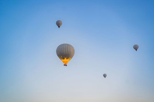 Beautiful hot air balloons over blue sky.