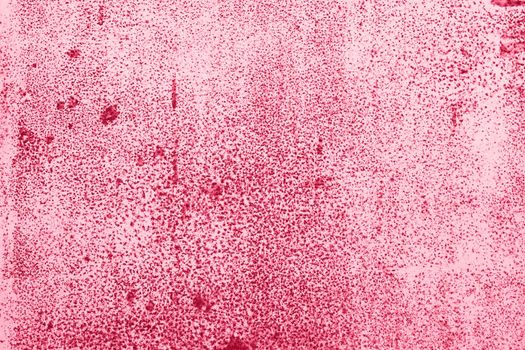 Viva Magenta wall with dirty scratches and metal stains. Metal rust monochrome background. High quality photo