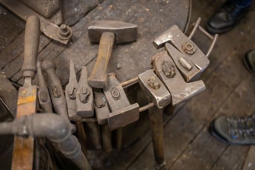 blacksmith tools and metal blanks in privet forge. High quality photo