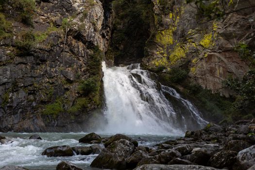 waterfall between old rocks beautiful nature background. High quality photo