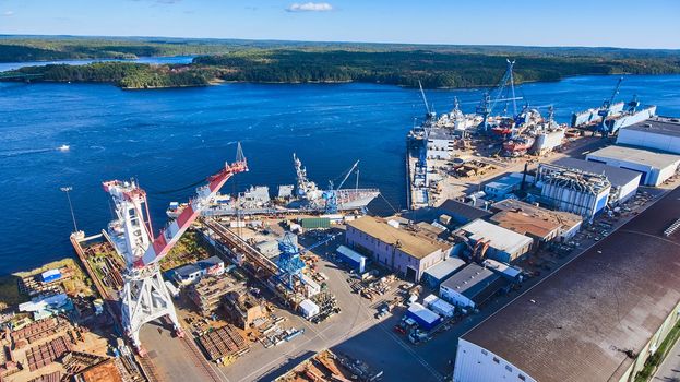 Image of Shipyard on Maine river from above as many large ships are being built